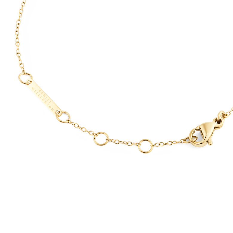 Detail of the Mirelle Solitaire Bracelet Gold showing the adjustable gold chain, secure clasp, and Daniel Wellington branded plate for a polished, elegant finish.