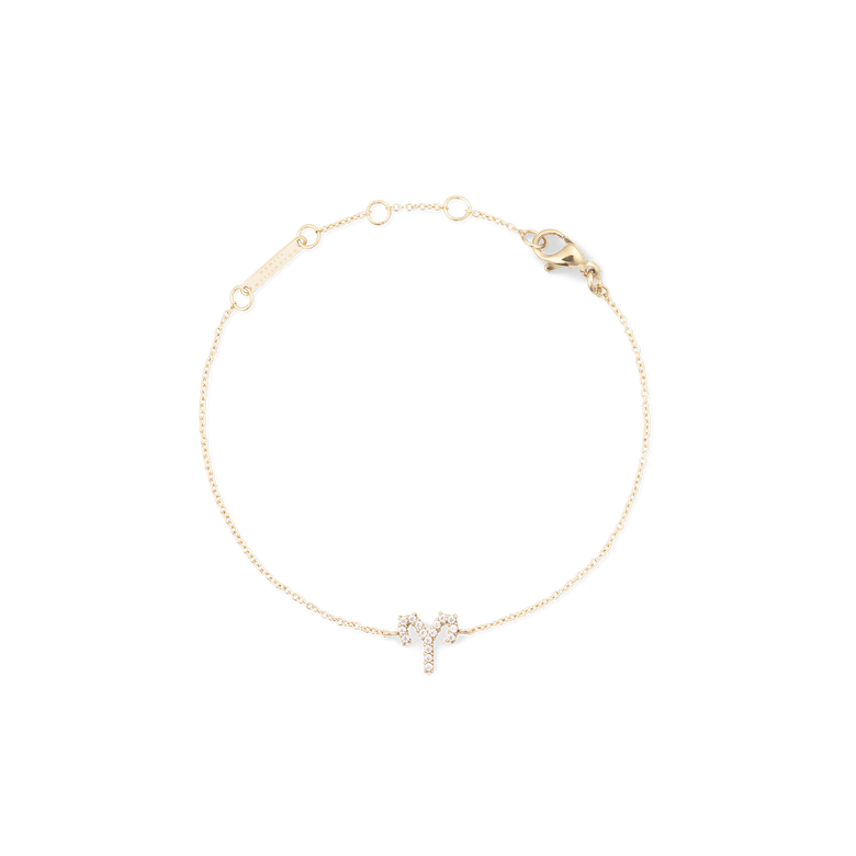 Delicate gold chain bracelet featuring an Aries zodiac charm set with sparkling crystals, adjustable with multiple sizing rings and finished with a secure lobster clasp.