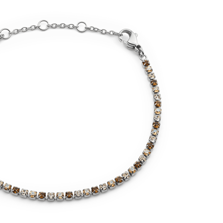Close-up of the Classic Tennis Bracelet Honey Combo Silver, showing alternating honey and clear crystals set in a slim silver chain with an adjustable lobster clasp.