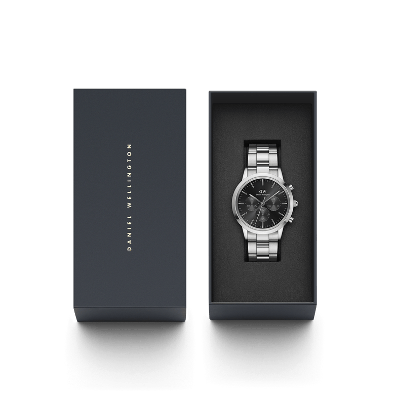 Iconic Chronograph Link Onyx S men's watch with a silver stainless steel bracelet and black dial, elegantly presented in a Daniel Wellington gift box.