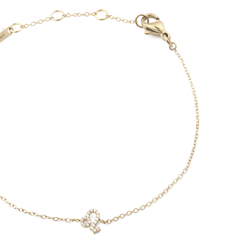 Gold chain bracelet with an adjustable clasp, featuring a Leo zodiac charm set with sparkling crystals and a slim, elegant design.