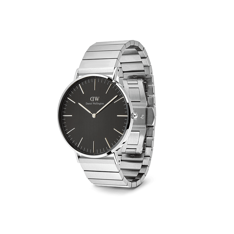 Classic Piano Link Onyx Silver men’s watch with a brushed black dial, minimalist hour markers, and a geometric silver stainless steel piano link strap, presented at a three-quarter angle.