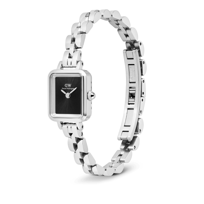 Quadro Mini Arch 3-link Onyx Sunray Silver displayed with its slim three-link stainless steel bracelet open, highlighting the petite rectangular silver case, minimalist black sunray dial, and button-less butterfly clasp.