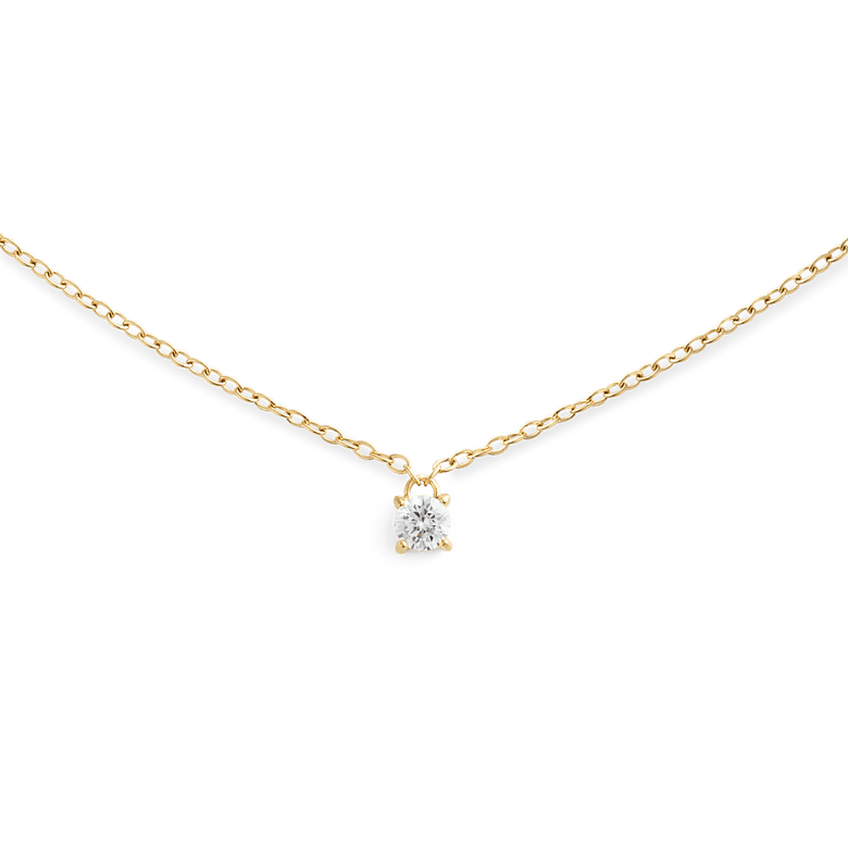 A delicate gold necklace featuring a fine chain and a single petite white cubic zirconia solitaire pendant, designed for a minimalist and elegant look.