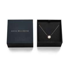 Audrey Necklace Mother of Pearl Rose Gold presented in an elegant black Daniel Wellington gift box, with the rose gold chain and domed mother of pearl pendant neatly displayed.
