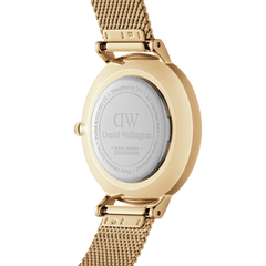 Back view of the Petite Lumine Bezel Evergold MOP gold watch, showing the engraved case back and adjustable gold mesh strap, highlighting its quality craftsmanship and attention to detail.