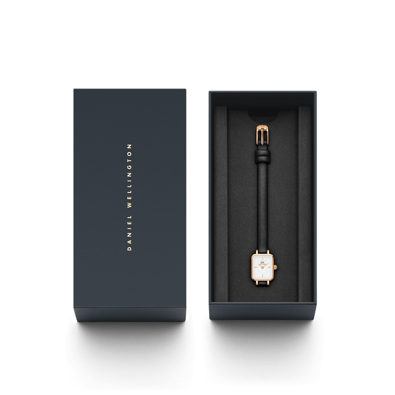 Quadro Mini Sheffield Rose Gold ladies watch presented in a sleek Daniel Wellington gift box, featuring a petite rectangular rose gold case, minimalist white dial, and slim black leather strap.