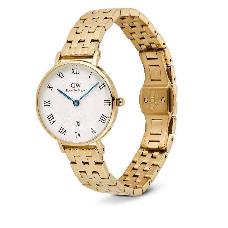 Petite Roman Numerals Date 5-link Gold ladies watch featuring a slim gold 5-link bracelet, white dial with Roman numerals, blue hands, guilloché texture, and a date window at 6 o’clock, shown with an open butterfly clasp.