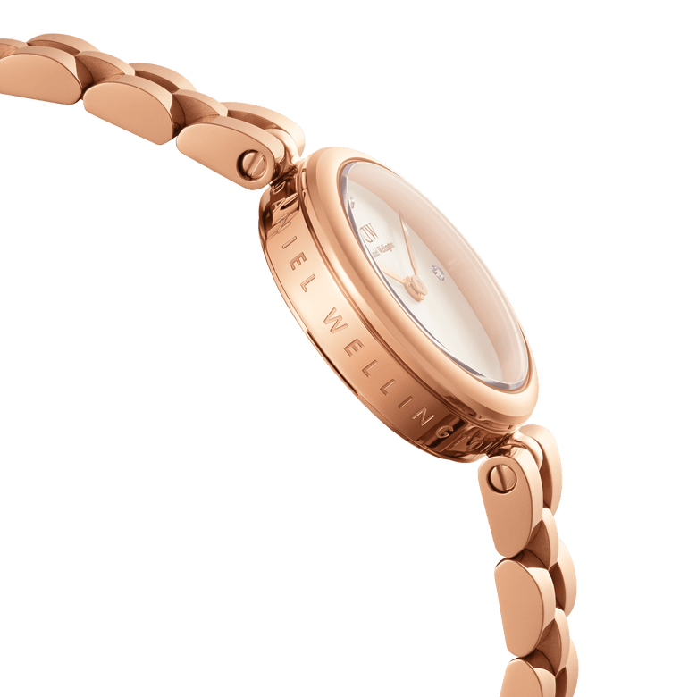 Side profile of the Elan Lumine Rose Gold ladies watch showcasing the engraved case, rose gold three-link bracelet, and minimalist dial with crystal markers.