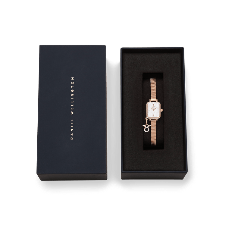 Quadro Mini Crystal Zodiac Melrose Set presented in a sleek black Daniel Wellington gift box, featuring a rose gold mesh strap watch with a rectangular crystal-framed case and zodiac charm.