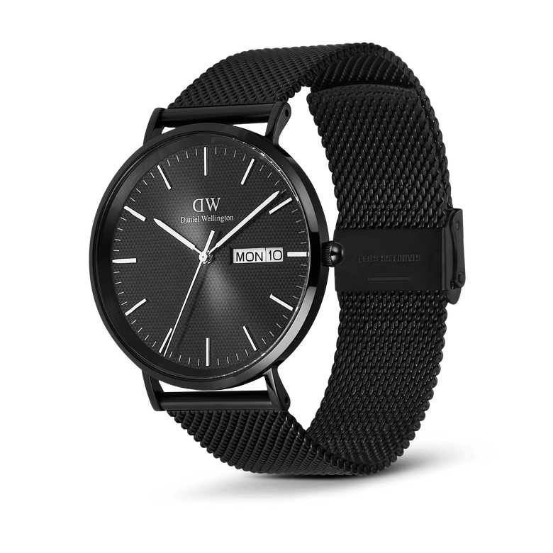 Classic Day Display Onyx Black men's watch featuring a textured black dial, day and date display, and an adjustable black mesh stainless steel strap.