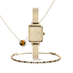 Honey Gold Set featuring a square gold watch with a mesh strap, a tennis bracelet with sparkling stones, and a pendant necklace with a tiger eye gemstone framed by crystals, all presented in a coordinated gold jewellery trio.