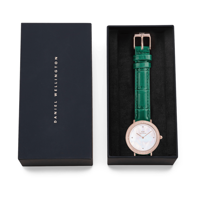 Crystalline Bezel Green Croc Rose Gold ladies watch presented in a Daniel Wellington gift box, featuring a rose gold-plated case, crystal-set bezel, white mother of pearl dial, and emerald green crocodile-embossed leather strap.
