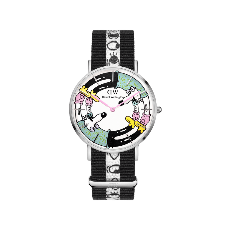 Limited edition Steven Harrington x Daniel Wellington 36mm watch featuring a colourful printed dial with psychedelic-pop artwork, stainless steel case, and a black and white NATO strap with a graphic eye-print.