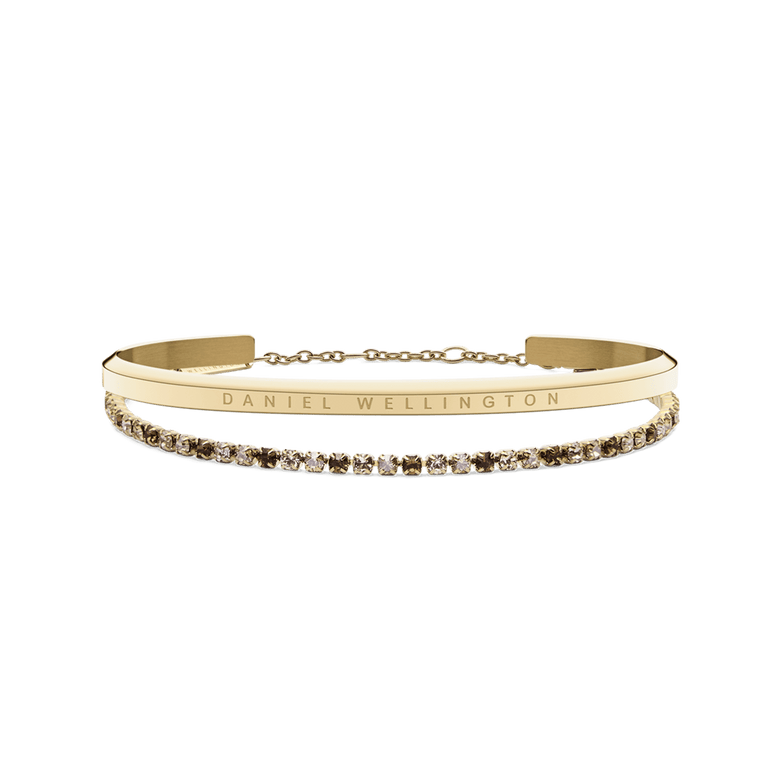 Classic Bracelet Gold & Tennis Bracelet Honey Combo Gold featuring a slim polished gold cuff engraved with Daniel Wellington and a delicate tennis bracelet with honey-coloured stones set in a gold chain, displayed side by side.