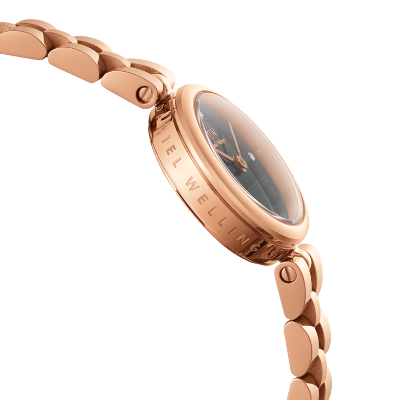 Close-up side view of the Elan Lumine Malachite Rose Gold ladies watch, showing the engraved case, rose gold bracelet links, and the green malachite dial with crystal markers.