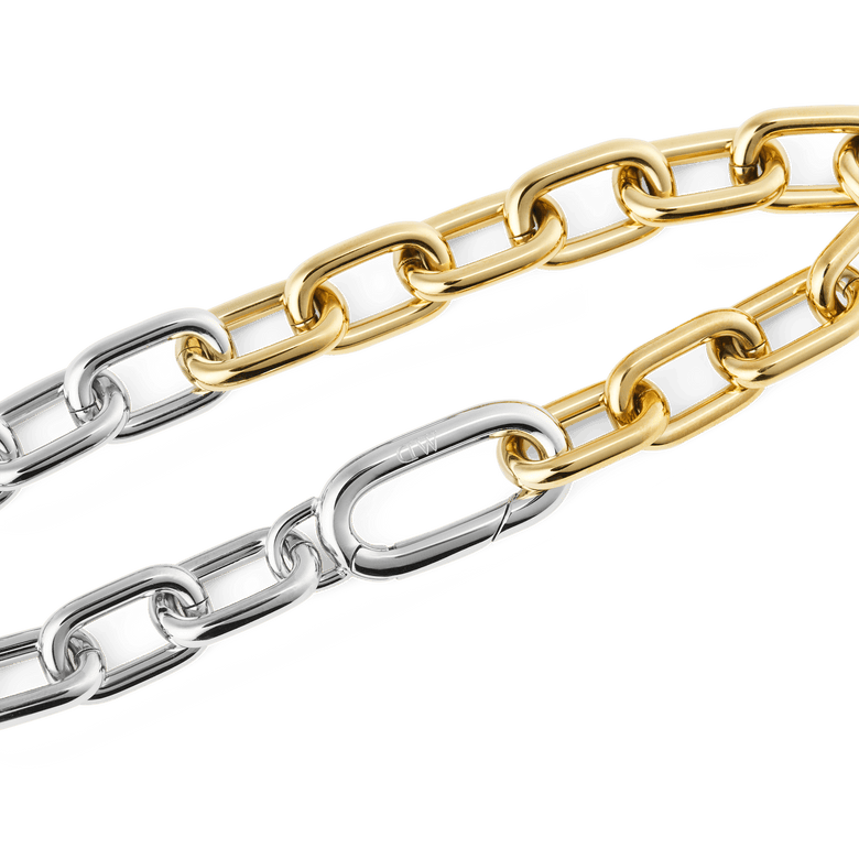Close-up of the Contrast Link Bracelet Two Tone Gold, highlighting the polished gold and silver rectangular links and the seamless clasp detail.