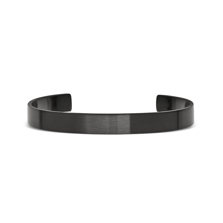 A minimalist graphite cuff bracelet with a brushed finish, featuring a slim 7 mm width and open design for easy adjustment and comfortable everyday wear.