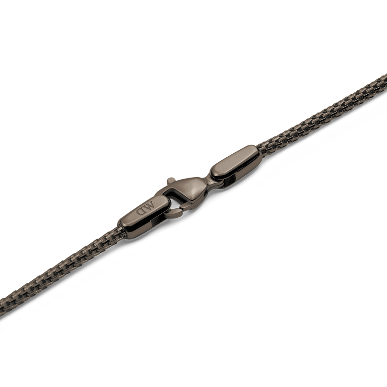 Detail of the Tide Mesh Necklace Graphite 1.8 showing the graphite mesh chain and secure lobster clasp with a polished finish.