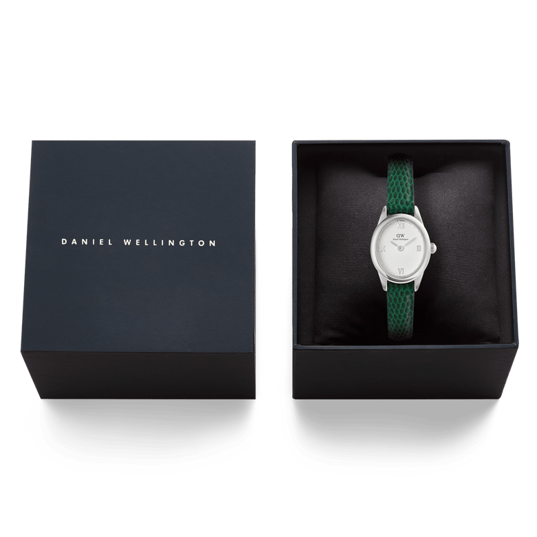 Daniel Wellington Ophelia Mini Green Lizard White Guilloché Silver watch displayed in its original gift box, featuring a green lizard-embossed leather strap and a petite silver case with a white guilloché dial.