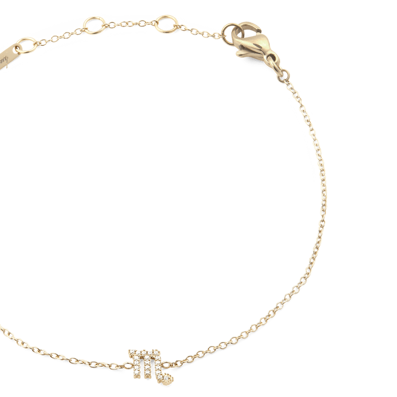 Close-up of the Crystal Zodiac Chain Bracelet Gold, highlighting the fine gold chain, adjustable sizing rings, and a sparkling Scorpio zodiac charm set with crystals.