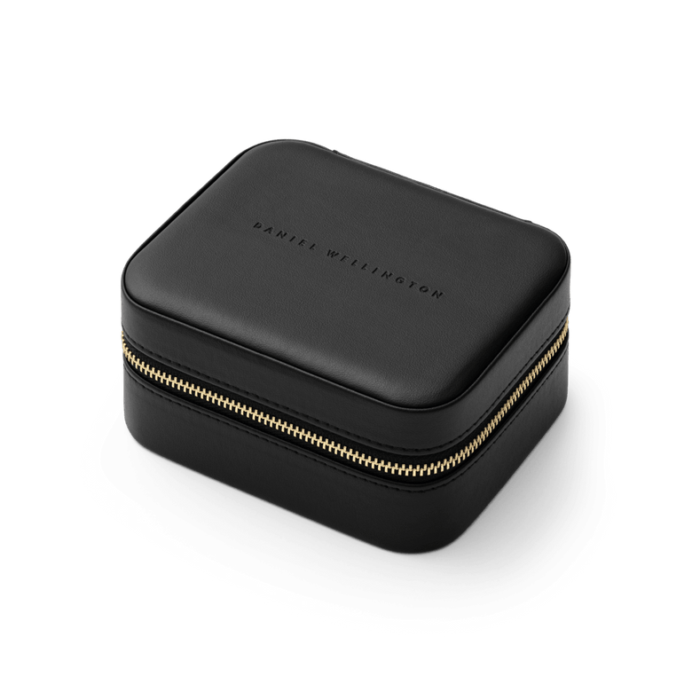 Travel Jewellery Box Black by Daniel Wellington featuring a sleek black exterior, gold zip closure, and embossed branding, designed for secure and stylish storage of accessories during travel.