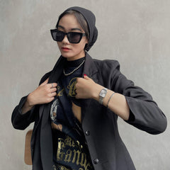 Quadro Pressed Unitone Silver ladies watch with a rectangular brushed silver dial and mesh strap, styled with a graphic tee, black blazer, and silver accessories for a contemporary urban look.