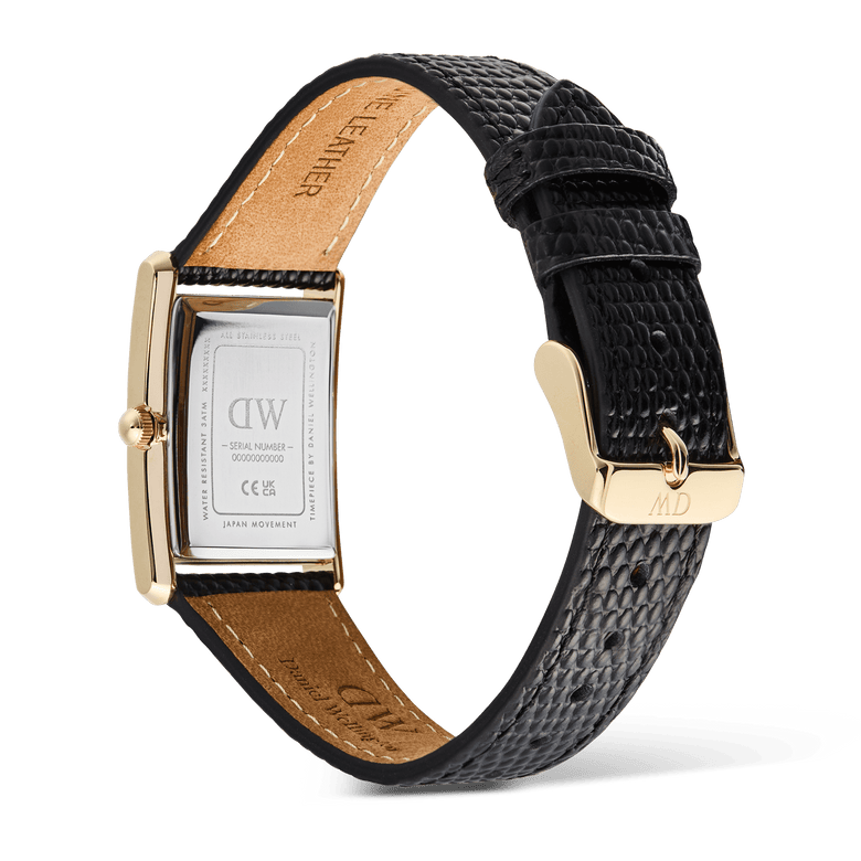 Rear view of the Bound Black Lizard Guilloché Gold watch showing the engraved stainless steel case back, gold-toned pin buckle, and textured black lizard grain leather strap with tan lining, highlighting the quality craftsmanship and adjustable fit.