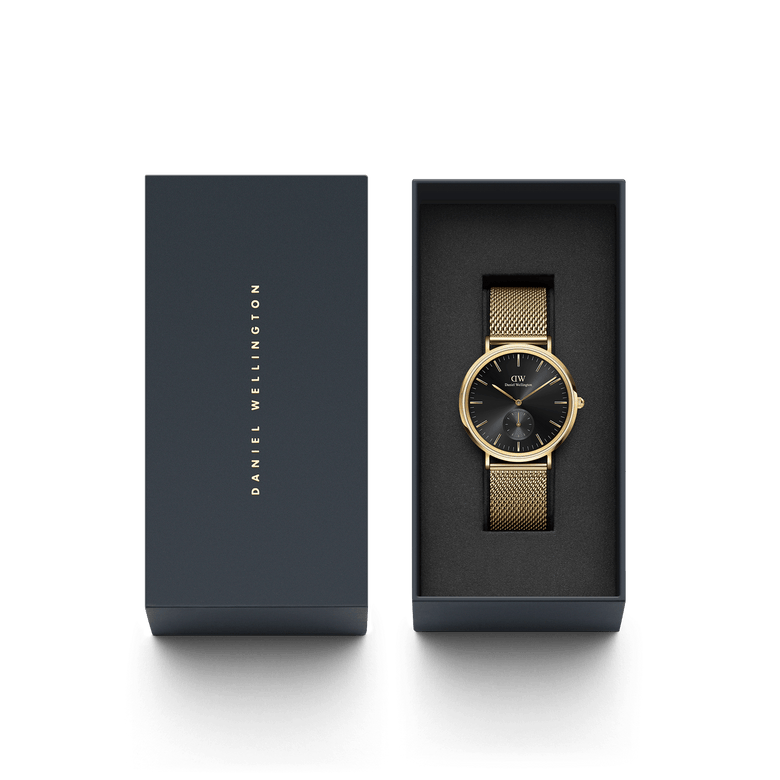 Classic Multi-Eye Evergold Onyx men's watch with a black multi-eye dial and gold mesh strap, presented in a sleek Daniel Wellington gift box.