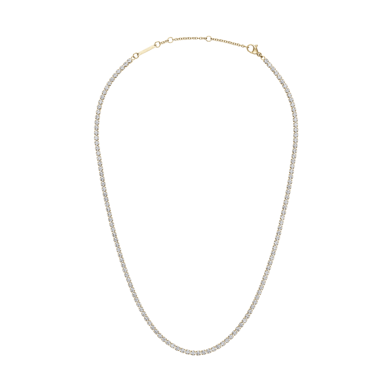 Classic Tennis Necklace Gold featuring a delicate gold chain with individually set sparkling crystals, shown with an adjustable clasp for versatile styling.