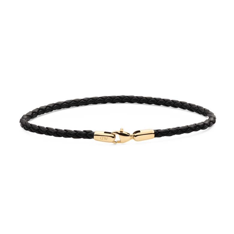 Slim black braided leather bracelet with a polished gold-plated stainless steel clasp, showcasing a minimalist and refined design suitable for men's everyday or formal wear.
