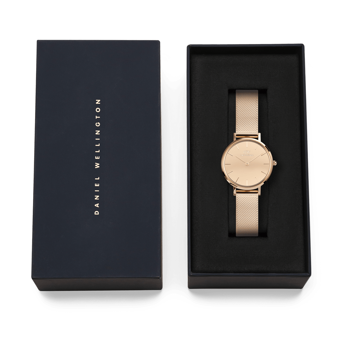 Petite Reflection Rose Gold watch by Daniel Wellington displayed in an elegant black gift box, featuring a slim rose gold mesh strap and minimalist mirror-effect dial.