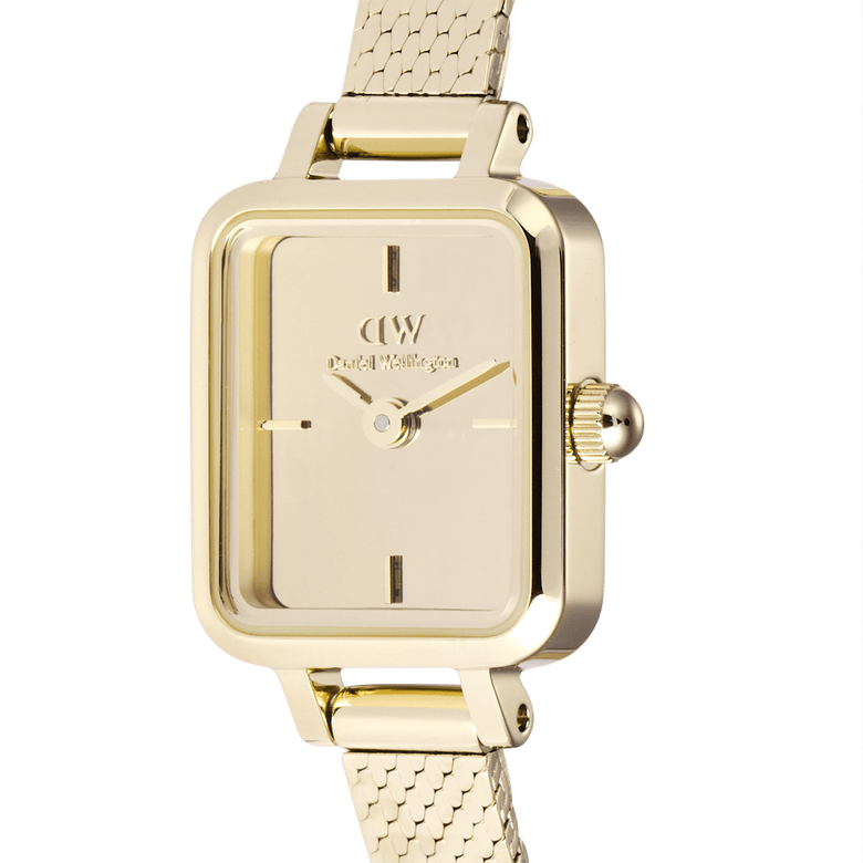 Close-up of the Quadro Mini Reflection Gold watch showing its polished rectangular gold case, minimalist mirror-effect dial, and fine gold mesh strap, highlighting its elegant and refined detailing.