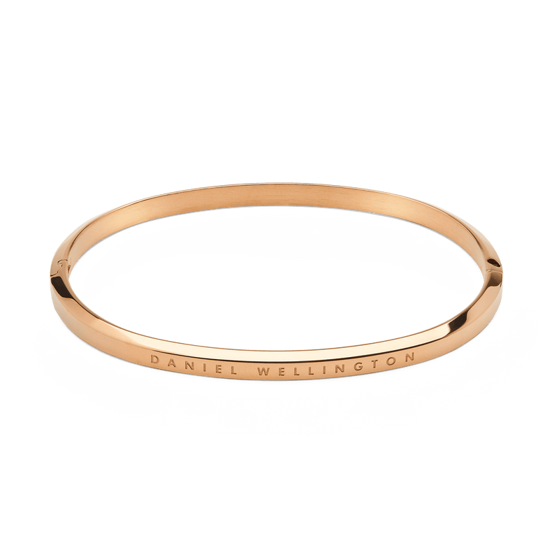 Minimalist Classic Bangle Rose Gold with a smooth, polished finish and DANIEL WELLINGTON engraved on the outer band, crafted from stainless steel with a secure hinge and lock closure.