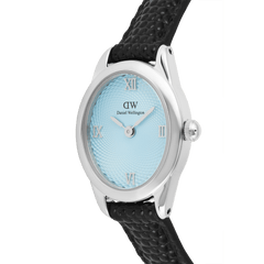 Close-up of the Daniel Wellington Ophelia Mini Black Lizard Ice Blue Guilloché Silver watch, highlighting the oval silver case, textured ice blue dial with Roman numerals, and black lizard-embossed leather strap.