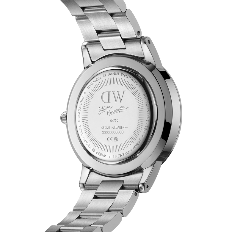 Daniel Wellington Iconic Link Multicolor Silver watch case back featuring Steven Harrington’s signature, limited edition number engraving, and polished stainless steel bracelet.