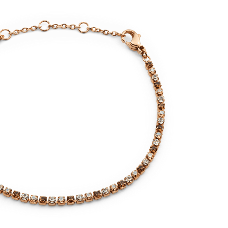 Close-up of the Classic Tennis Bracelet Honey Combo Rose Gold, showing alternating honey and clear crystals set in a slim rose gold chain with an adjustable lobster clasp.