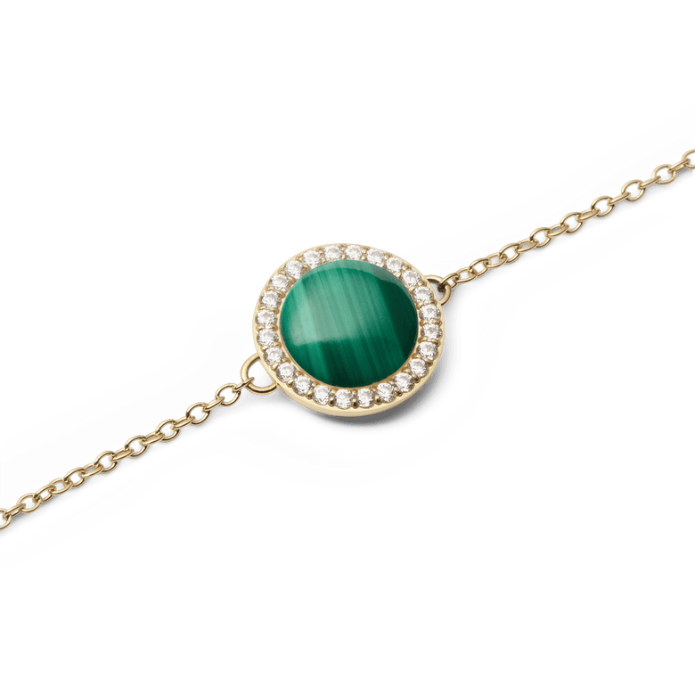 Close-up of the Audrey Bracelet Malachite Gold, highlighting the round green malachite centre stone surrounded by a halo of sparkling white cubic zirconia on a fine gold chain.