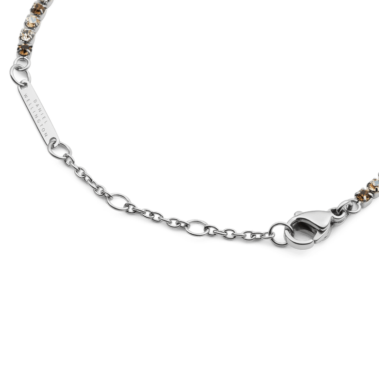 Detail of the Classic Tennis Bracelet Honey Combo Silver, highlighting the adjustable silver chain, lobster clasp, and alternating honey and clear crystals.