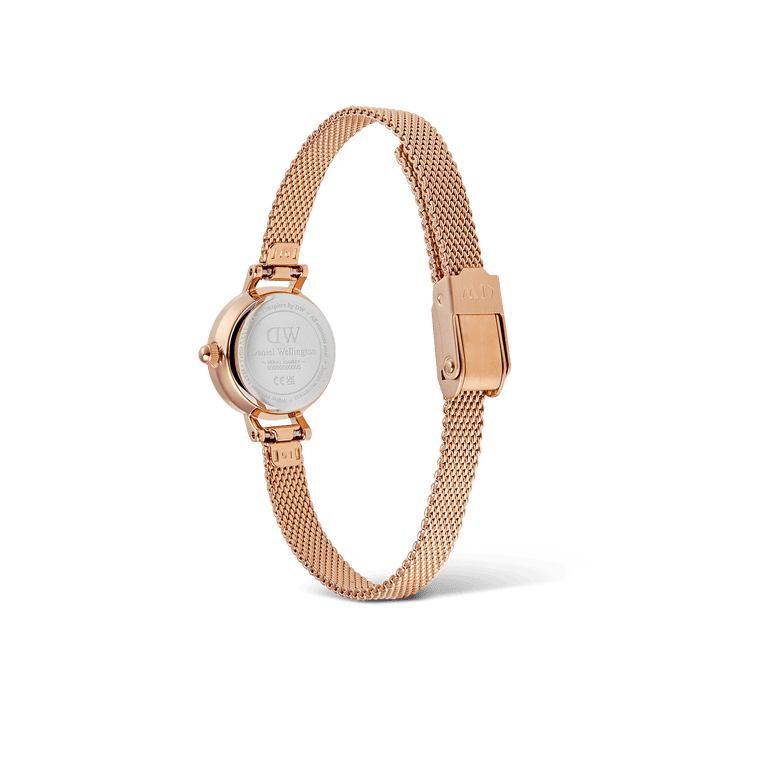 Petite Mini Champagne Melrose watch shown from the back, highlighting the stainless steel case and rose gold mesh strap with a secure clasp.