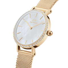 Close-up of the Petite Lumine Bezel Evergold MOP gold watch, featuring a white mother of pearl dial, gemstone bezel, and an adjustable gold mesh strap, highlighting its elegant and refined details.