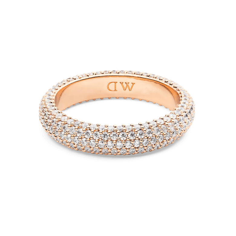Pavé Ring Rose Gold 5 mm featuring a wide rose gold band set with three rows of sparkling white cubic zirconia crystals in a pavé setting, offering a refined and elegant look.