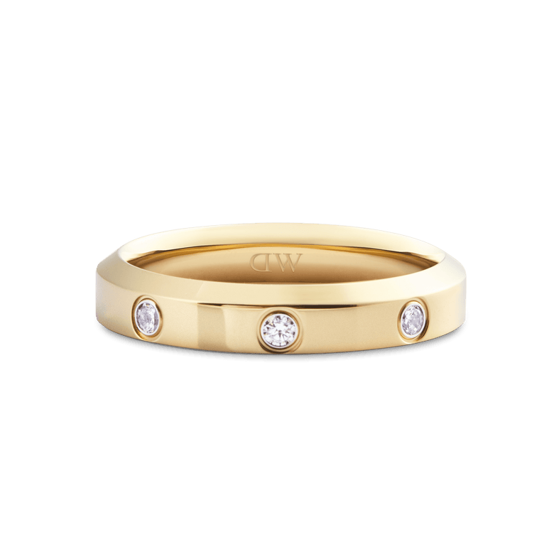 Classic Lumine Ring Gold 4 mm featuring a polished gold band with three round cubic zirconia crystals set evenly across the front, showcasing a minimalist and elegant design.