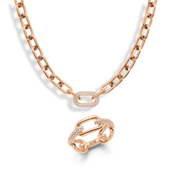 Rose gold chain necklace and matching crystal link ring featuring pavé stones, both showcasing a bold link motif with a modern, elegant finish.