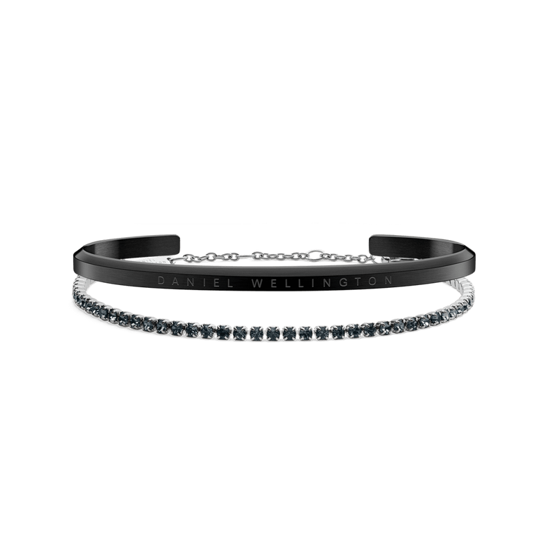Classic Bracelet Black and Tennis Bracelet Nightfall Silver set featuring a matte black cuff with subtle branding and a silver tennis bracelet adorned with sparkling stones, displayed against a plain background.