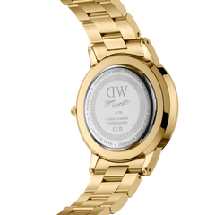 The back of the Steven Harrington x Daniel Wellington Iconic Link Dual Tone gold watch, showing the engraved limited edition details, artist signature, and serial number on the stainless steel case.