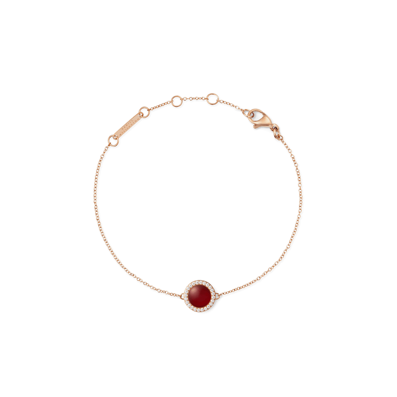 Rose gold bracelet with a slim adjustable chain, featuring a round red agate centrepiece surrounded by a halo of white cubic zirconia crystals.