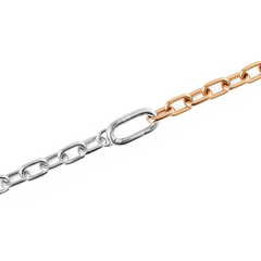 Close-up of the Contrast Link Necklace Two Tone Rose Gold, highlighting its polished architectural links in a seamless half silver and half rose gold design with a smooth, squared silhouette.
