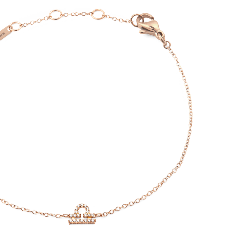 Close-up of the Crystal Zodiac Chain Bracelet Rose Gold, highlighting the fine rose gold chain, adjustable sizing rings, and a sparkling crystal Libra zodiac pendant.