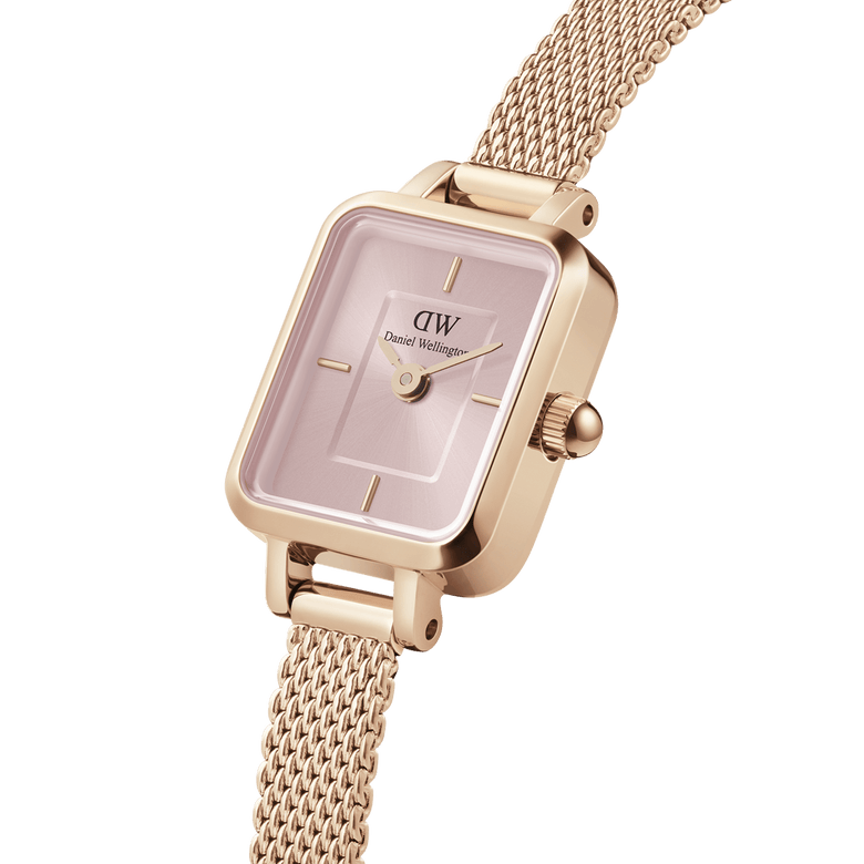 Quadro Mini Melrose Blush watch with a soft pink rectangular dial, rose gold mesh strap, and minimalist hour markers, highlighting its elegant and contemporary design for women.